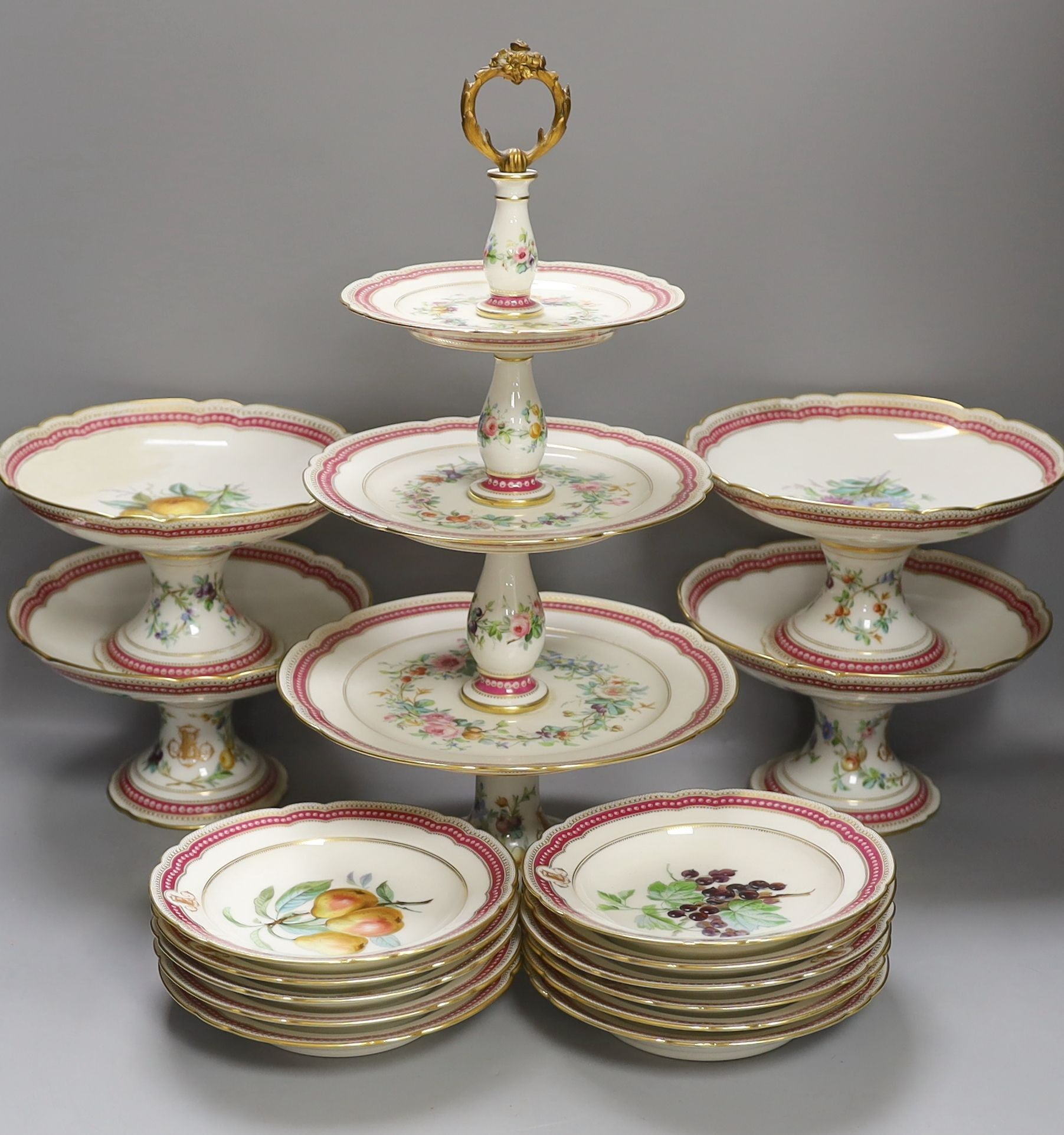 A late 19th century Paris porcelain floral part dessert service, with 2 pairs of comports, a three tier cake stand and eleven dishes.